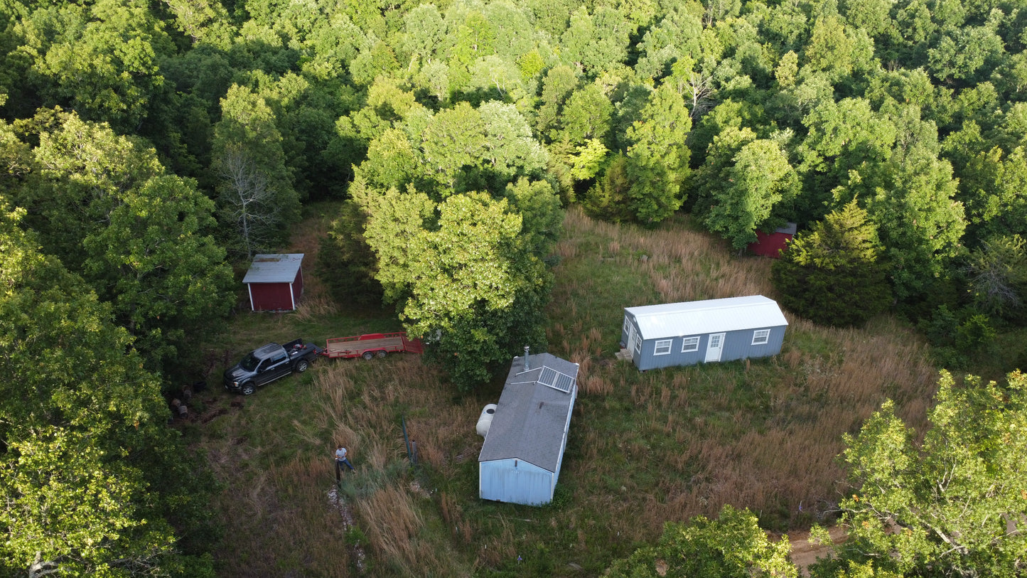 Hidden Missouri Gem: 10.61 Acres with Cabins and Wildlife!