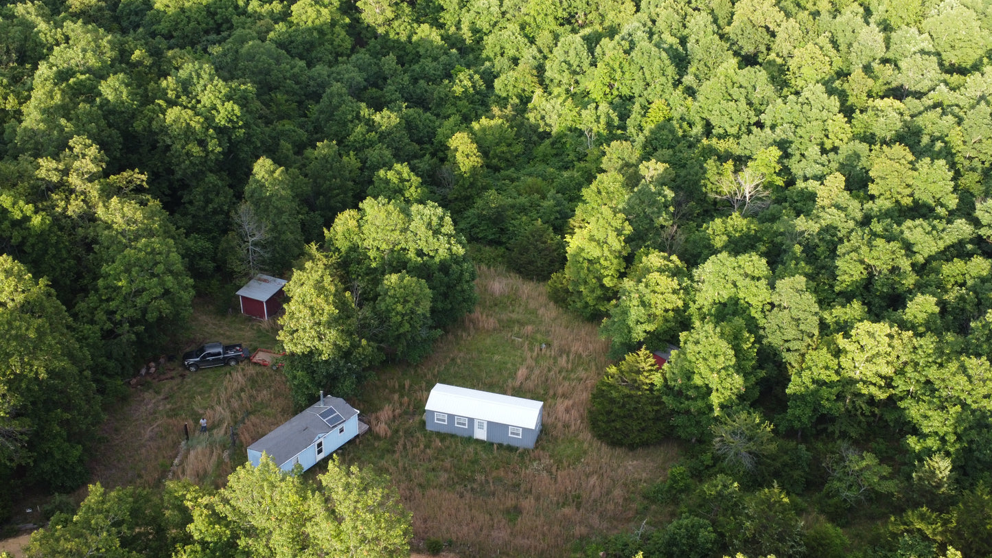 Hidden Missouri Gem: 10.61 Acres with Cabins and Wildlife!